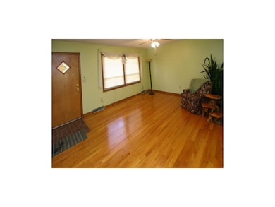The Living room has beautiful hardwood floors.