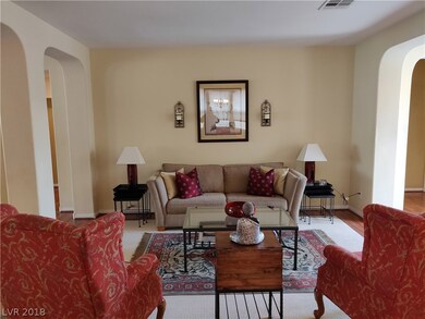 Living Room: Warm painted walls, archways and inse