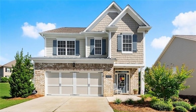 Craftsman house with a garage, concrete driveway, 