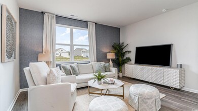 Living room featuring wood finished floors and baseboards