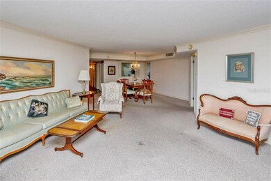 Living room looking back to dining and kitchen