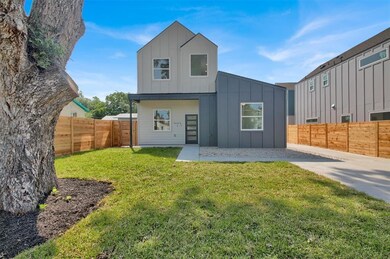 Back of property featuring board and batten sidin