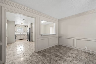 This photo shows a bright room with tiled flooring