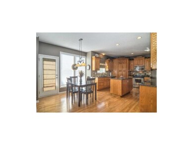 Great eat-in kitchen with beautiful wood flooring 