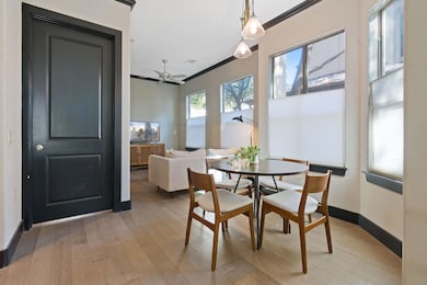 Dining area with crown molding, baseboards, ceili