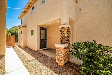 View of exterior entry featuring stucco siding and