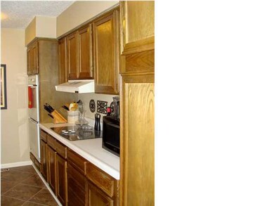 Double ovens in this fully applianced kitchen with