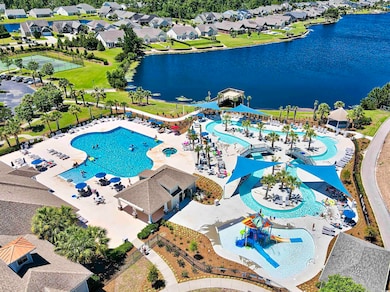 Drone / aerial view featuring a water view and a r