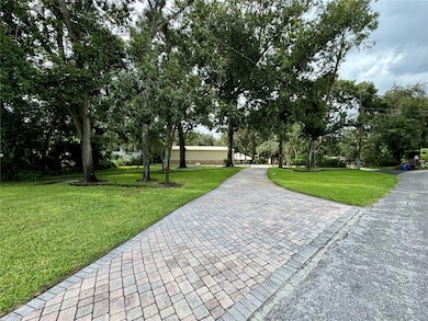 Entry from Street to Fenced Riverfront Estate