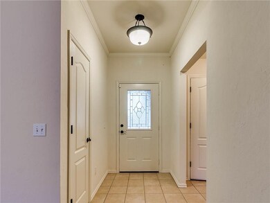 Beautiful front door and entry way. Garage door is