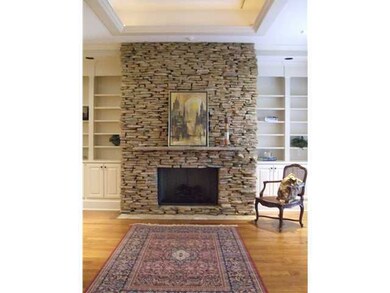 Stack stone fireplace in hearth room off  kitchen 