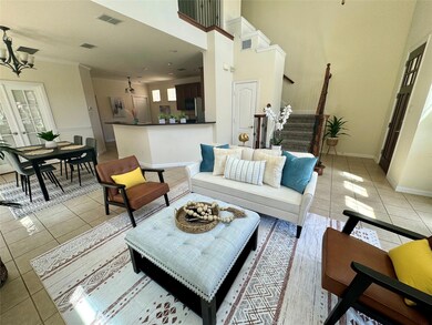 Living room featuring light tile patterned floors 