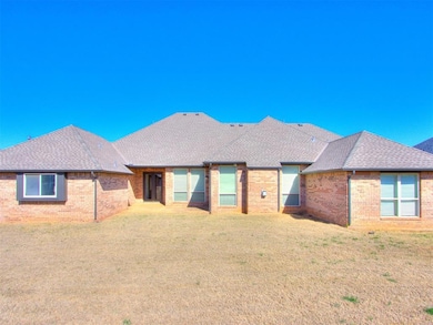 View of front of property with a front yard, a shi