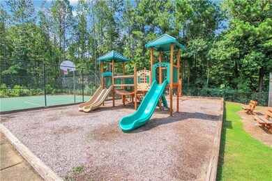 Community jungle gym with community basketball court