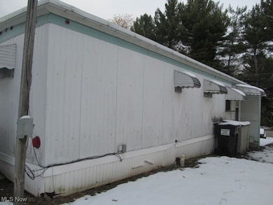 View of snowy exterior featuring crawl space