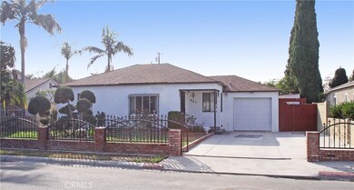 Beautiful curb appeal, large gated driveway and single car garage.