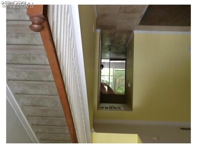 Stairs to bedrooms and office