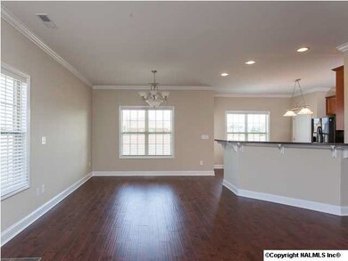 Dining area open to the kitchen and gathering room makes this a wonderful plan for a large gatherings