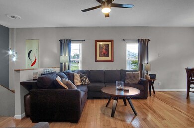 Bright living room with bamboo floors, modern lighting and great open floor.