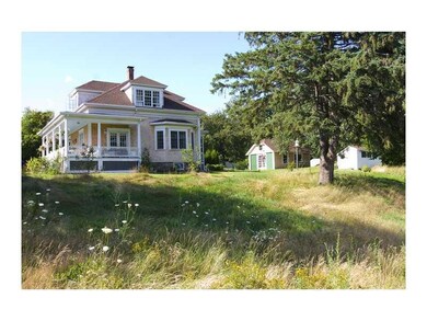 Exterior Front. Side Yard in the Summer