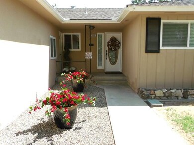 WELCOMING COVERED PORCH. NOTE DUAL PANE WINDOWS TH
