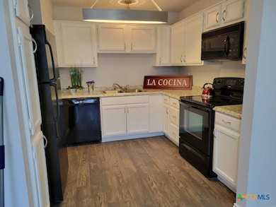 Kitchen with refrigerator