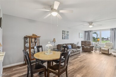 Dining room with light LVP floors and a ceiling fan