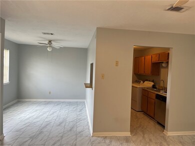 Kitchen featuring stainless steel dishwasher, wash