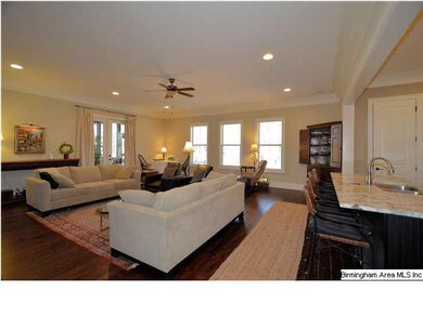 Hand scraped wood floors are in greatroom and thro