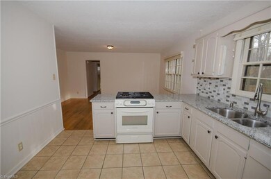 Kitchen with tile floor.