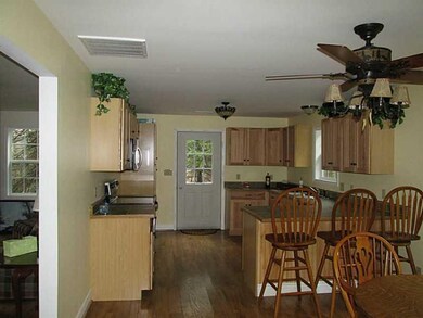 Kitchen. Looking towards the outside entry with th