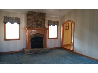 Great room with beautiful fireplace and cathedral 