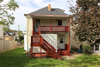 The rear yard connects to the alley behind the uni