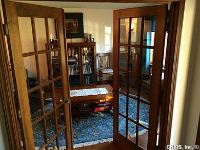 Library. Beautiful French doors grace this home