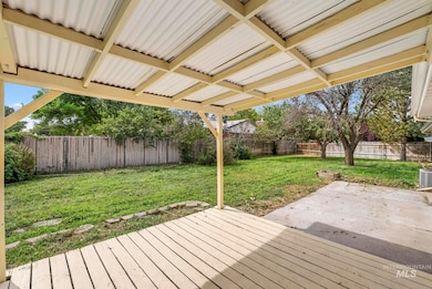 Wooden deck featuring a fenced backyard