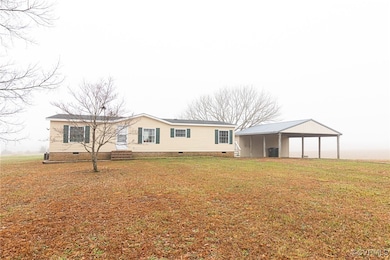 View of front of property with a carport and a fro