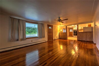 The large living room boast hardwood floor, light 