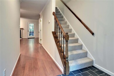 View from front door. Hallway and stairway to 2nd 