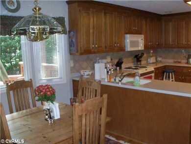 Kitchen - Corian counters, ceramic tile backsplash