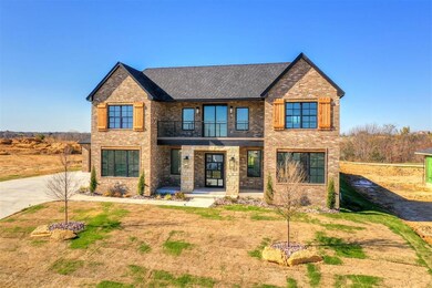 View of front of property with a balcony