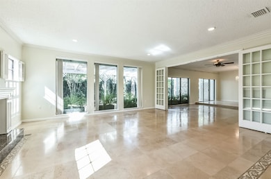 LIVING ROOM II-Another perspective of this dramatic and open space with views to the lush outdoor area.