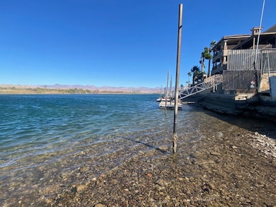 Dock featuring a water and mountain view