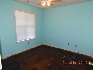 BED ROOM TWO HAS STAIN CONCRETE FLOOR, CEILING FAN