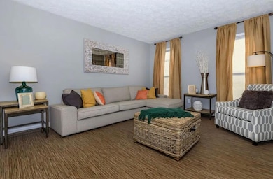 Living room featuring a textured ceiling