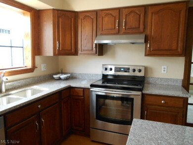 fully appliance stainless steel kitchen.  granite counter tops ..and plant window above the sink