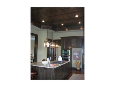 Another view of kitchen- note the finished ceiling