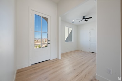Doorway to outside with wood finished floors, ceiling fan, and recessed lighting