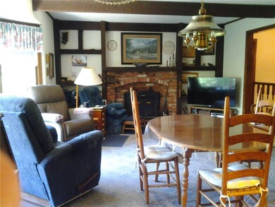 Hearth room, wood burning stove in fireplace.  to 