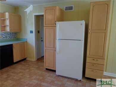 Kitchen is equipped with a White Refrigerator.
