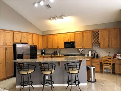 Kitchen with Knotty Maple Cabinets & Granite count